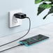 3.0 usb charger is plugged into the wall socket with braided cable connected to  it which is charging the phone