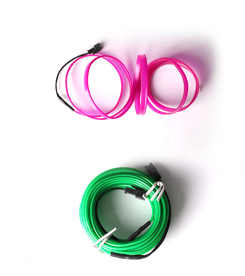 An image showing neon dashboard lights in pink and green colors 