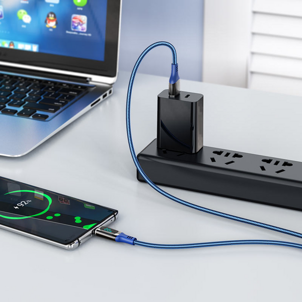 An image showing usb to type-c  being connected to the phone, placed beside laptop