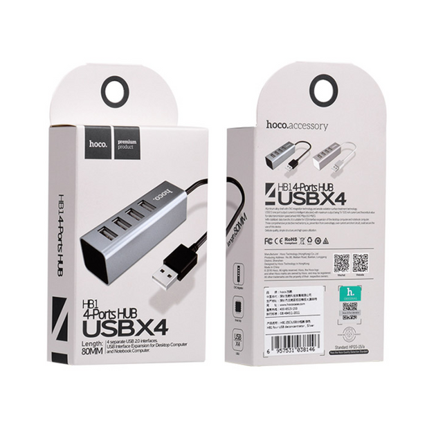 A white, plastic USB hub with four parts, labeled "USBX" It's connected to a laptop through a black USB cable. The packaging is a white box with a blue stripe