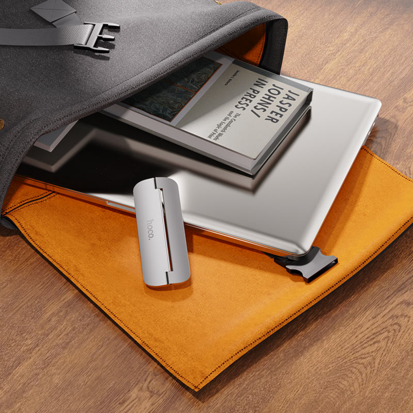 An image showing Metal Foldable Laptop Stand (PH40) is out of laptop bag with laptop and books

