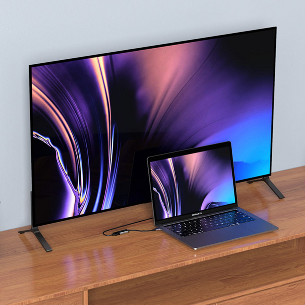 An image showing Type-C to HDMI Converter (HB21) being connected to laptop and Tv to expand display form laptop to the huge TV in 4K

