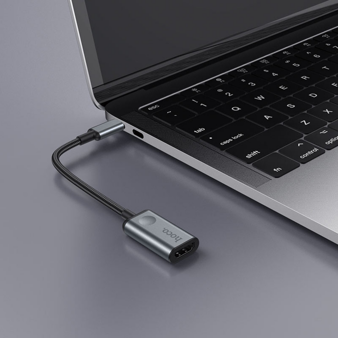 An image showing Type-C to HDMI Converter (HB21) being connected to Laptop using type-c connection

