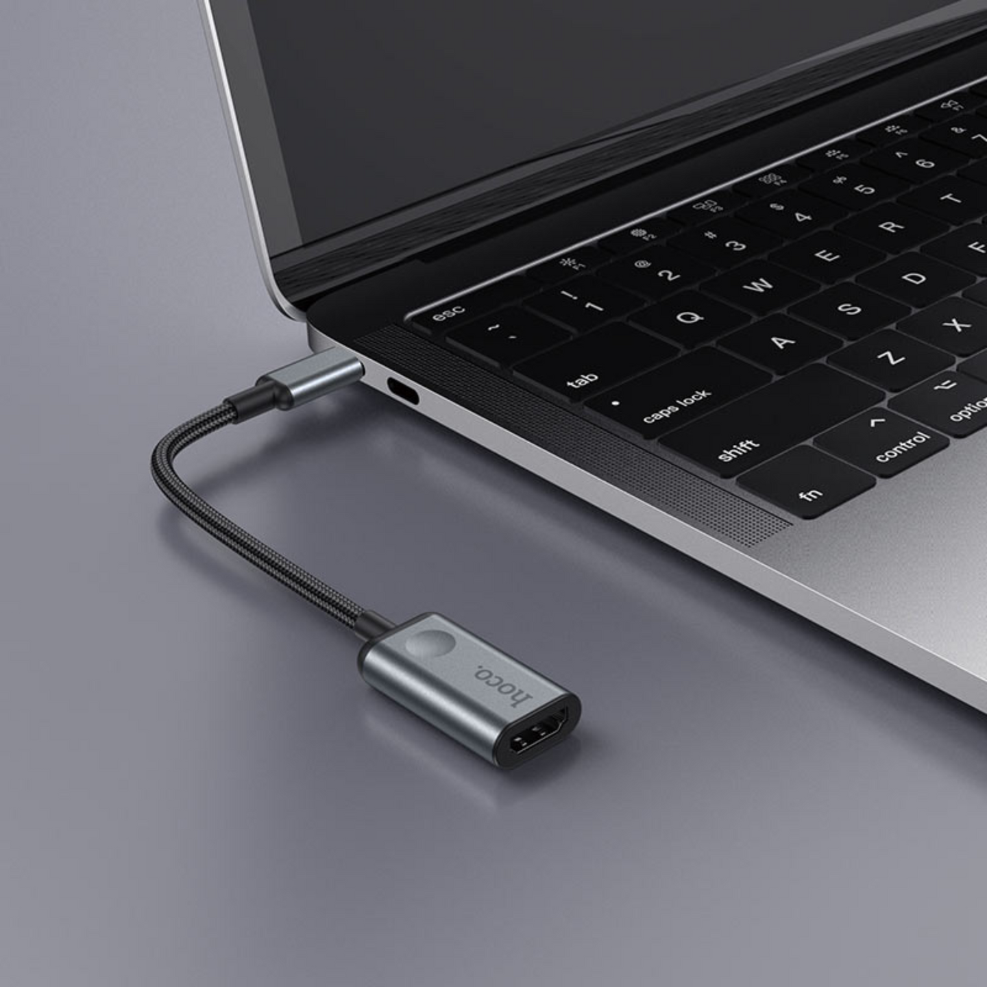 An image showing Type-C to HDMI Converter (HB21) being connected to Laptop using type-c connection

