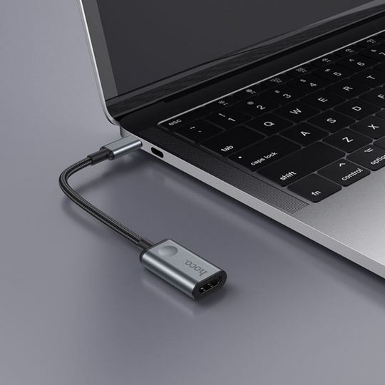 An image showing Type-C to HDMI Converter (HB21) being connected to Laptop using type-c connection

