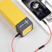 This picture is showing the aux cable being connected to the bluetooth speaker and the phone simulanteously