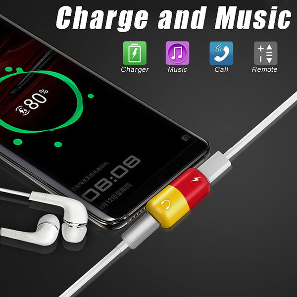 Close up  view of 2 in 1 Type C to USB  placed next to a phone with charging cable and earphones connected to 2 in 1 Type C adapter