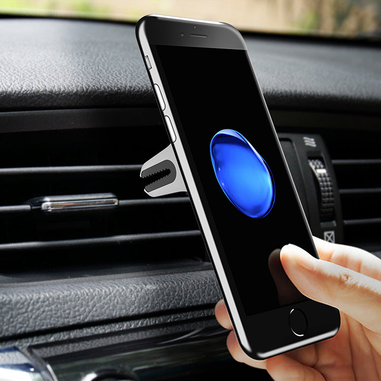 Close up view of car phone holder being attached to the phone about to be used in the aircon vent 